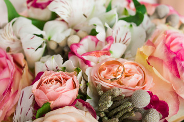 wedding rings and flowers