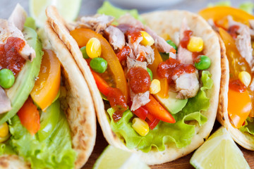 Fajitas with chicken, vegetables and spicy sauce salsa.