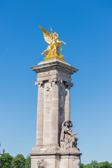 Fototapeta na wymiar Paris, pont Alexandre III, golden statue on the bridge 