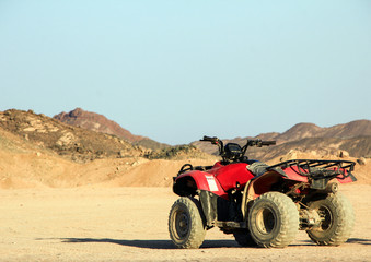 ATV in the desert against the background of the mountains. Safari on quad bikes. Egypt, May 2012 year. © dimakig