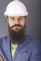 Portrait of a bearded engineer with arms folded