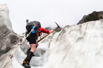 woman climbing glacier