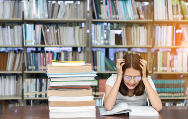Young Girl Student with Glasses Reading book Overlap Serious, Hard Exam, Quiz, Test Sleeping headache worry in Classroom Education Library University Knowledge center