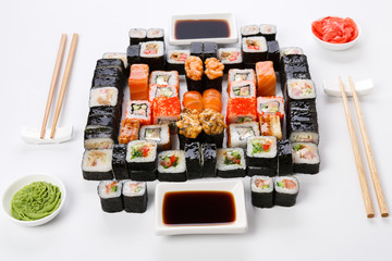 Set of sushi, maki and rolls on white background