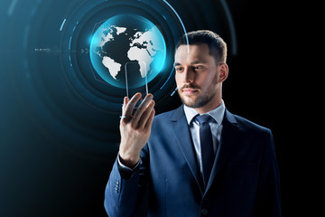 businessman with smartphone and virtual globe