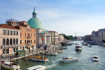 VENICE, ITALY - May 18, 2017.View of water street and old buildings in Venice on May 18, 2017. its entirety is listed as a World Heritage Site, along with its lagoon