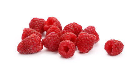 Fresh red ripe raspberries on white, close up