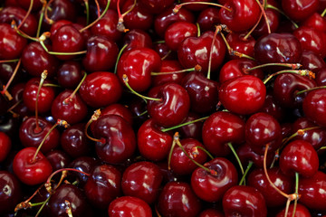 Fresh red cherries on retail market close up