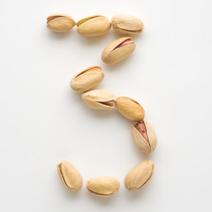 Numeral pistachios white background