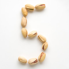 Numeral pistachios white background