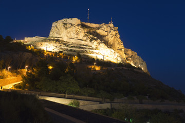 Castle of Santa Barba illuminated at night in the city of Alicante, Comunidad Valenciana, Spain.