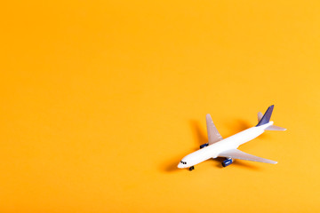 Miniature airplane travel theme on a bright background © Tierney
