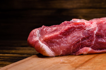 Raw pork meat on cutting board