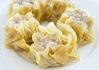 The close up of the Chinese steamed dumpling with pork.