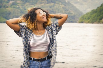 happy girl enjoying outdoor, landscape with water