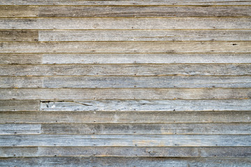 weathered wood siding of abandoned farm house
