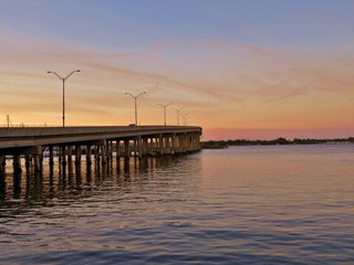 Fototapeta premium Sun setting at River walk along the Manatee River in Bradenton Florida