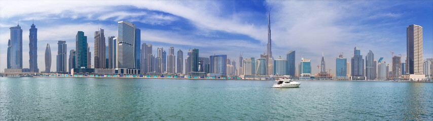 Fototapeta na wymiar DUBAI, UAE - MARCH 29, 2017: The panorama with the new Canal and skyscrapers of Downtown.