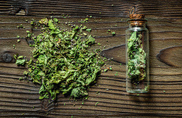 Alternative medicine. Store up medicinal herbs. Dried herbs on wooden table background