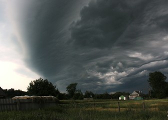 Storm clouds over a rural home.
