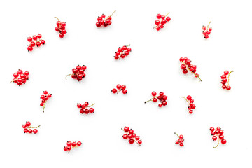 Fototapeta na wymiar Berry pattern. Red currant on white background top view.