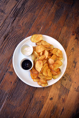 top view on plate with home made potato chips
