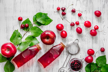 Cranberry morse with apple and pulm on wooden table background top view copyspace © 9dreamstudio