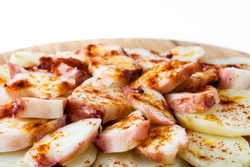 Pulpo a la gallega. Galician octopus isolated on white background. Typical spanish food

