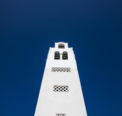 White building against a blue sky in Santorini, Greece