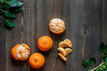 Fresh oranges and mandarins on wooden table background top view copyspace