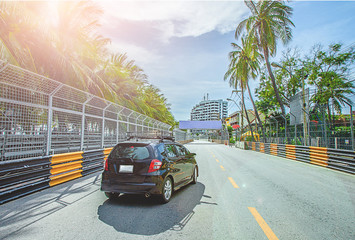 Soft focus image The car is on the street or racetrack Beach During the day in The bright sky
