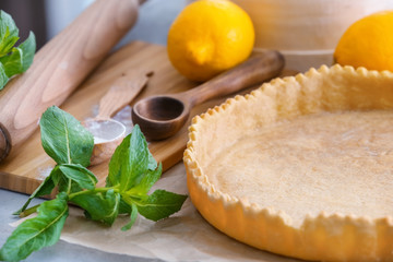 Composition with empty pie crust on table, closeup