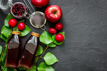 Summer fruit tea with apple and pulm on wooden table top view copyspace