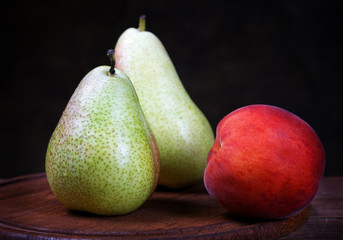 Peach and pear closeup on a rural table