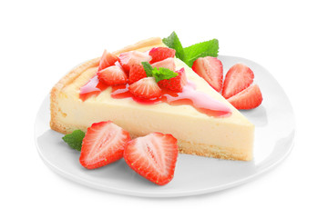 Plate with piece of homemade strawberry cake on white background