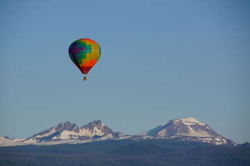 Fototapeta na wymiar Hot Air Ballooning over Mountain Tops