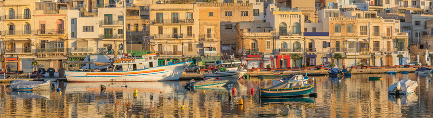Fototapeta na wymiar View to marina with boats from waterfront in the morning, Malta