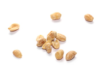 Pile salted fried peanut isolated on white