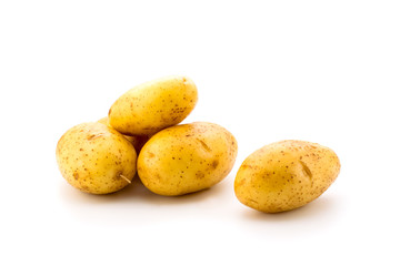 Young potatoes on a white