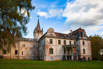 Fototapeta na wymiar Old fairy-tale palace in Stameriena, Latvia. Fall time, bright colors.