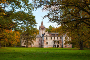 Fototapeta premium Old fairy-tale palace in Stameriena, Latvia. Fall time, bright colors.