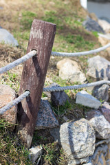 Fence a wooden pole with a tight rope