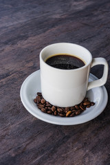 Black Coffee in a white cup set and coffee been