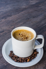 Cappuccino Coffee in a white cup set and coffee been