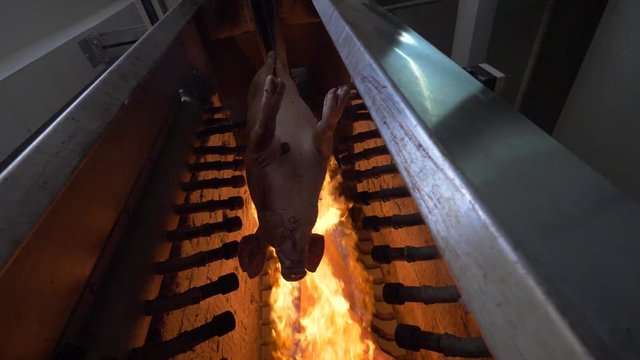 Thermal processing of pork meat with open fire
