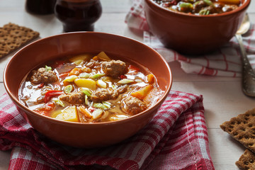 Lentil soup with meatballs and pepper and onion