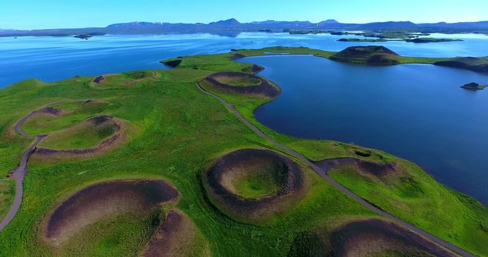 Volcanic Craters In Green Plains By Blue Water Bay - Aerial Footage of Myvatn, Iceland