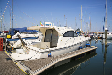 Fototapeta premium Yachts in the port waiting. On the sea is calm.