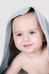One year old baby with towel