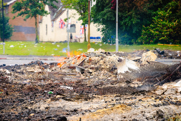 Remains of an 11th night bonfire on the morning of the 12th July.  Bonfires are traditionally lit by the Protestant Community on the 11th July to commemorate the Battle of The Boyne in 1690.
